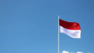 Indonesian's flag through the blue sky
