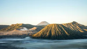 Landscape view of Mount Bromo crater and Mount Semeru volcano in East Java, Indonesia, during sunrise.