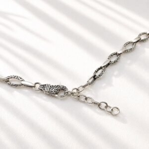 Detailed oval link silver chain Bali handmade artisan jewelry close up