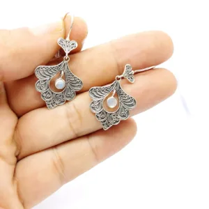 Bohemian peacock earrings crafted in artisan silver style