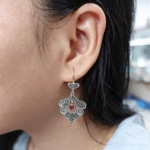 Statement sterling silver peacock earrings with intricate detail