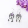 Celestial sterling silver moon earrings symbolizing intuition and femininity