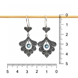 Handmade sterling silver peacock earrings inspired by Balinese culture