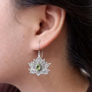 Close-up of detailed lotus flower earrings in sterling silver