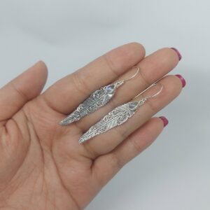 Bohemian sterling silver feather earrings symbolizing freedom