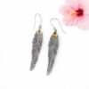 Lightweight handmade silver feather earrings with artisan design