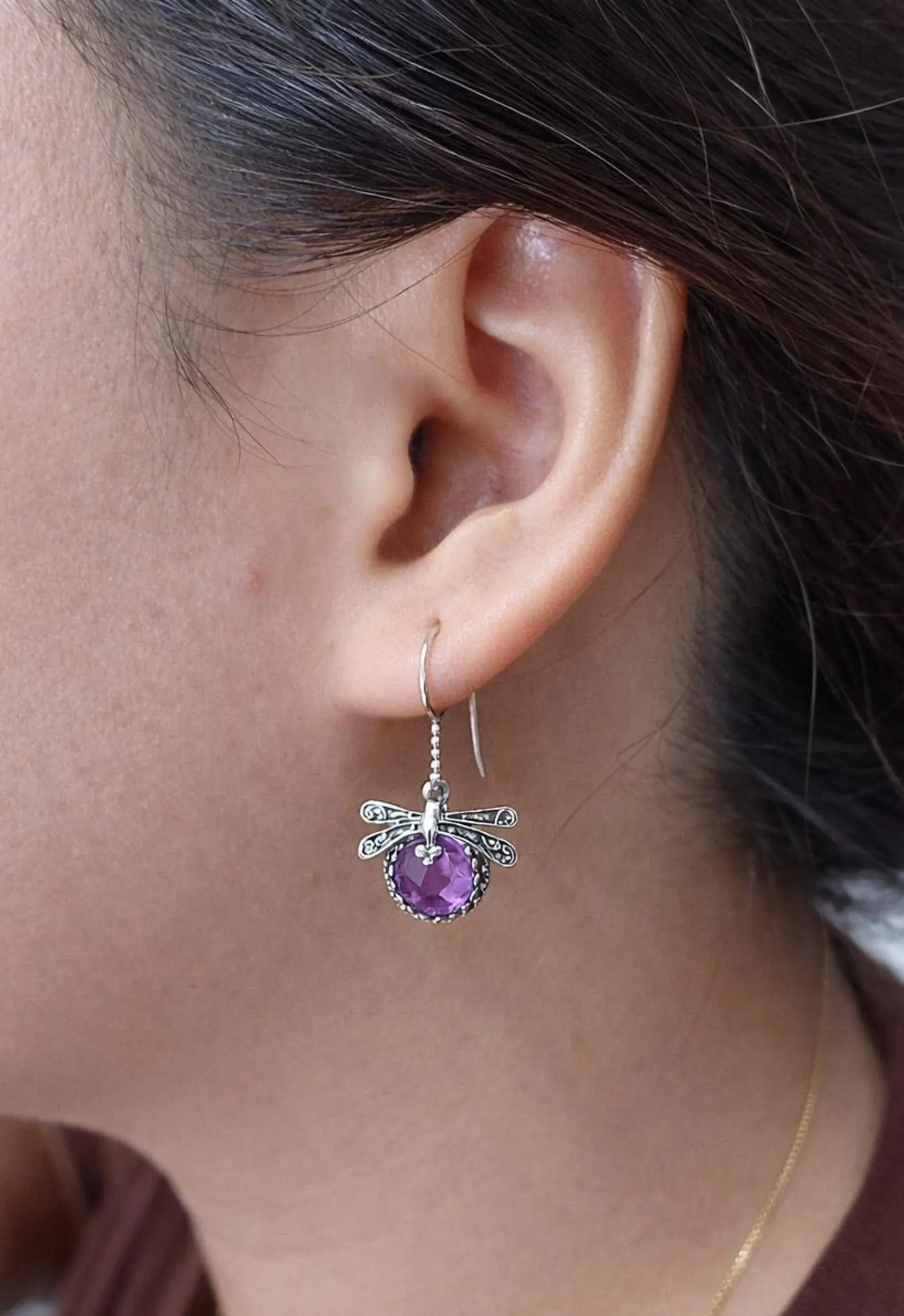 Handmade Silver Dragonfly Earrings on Model Handmade sterling silver dragonfly earrings inspired by nature
