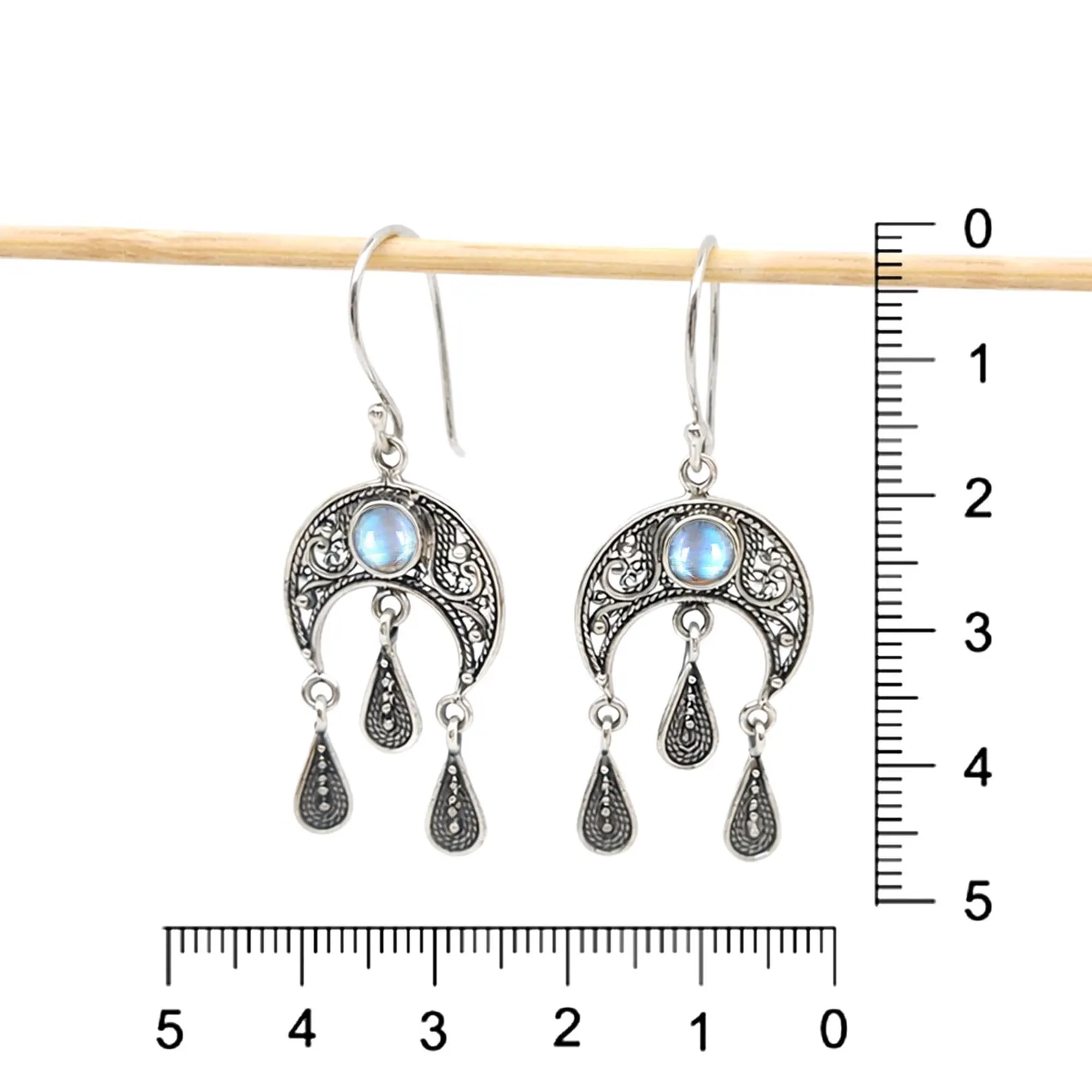 Minimal Lunar Earrings Detail Shot Close-up of elegant boho crescent moon earrings in sterling silver