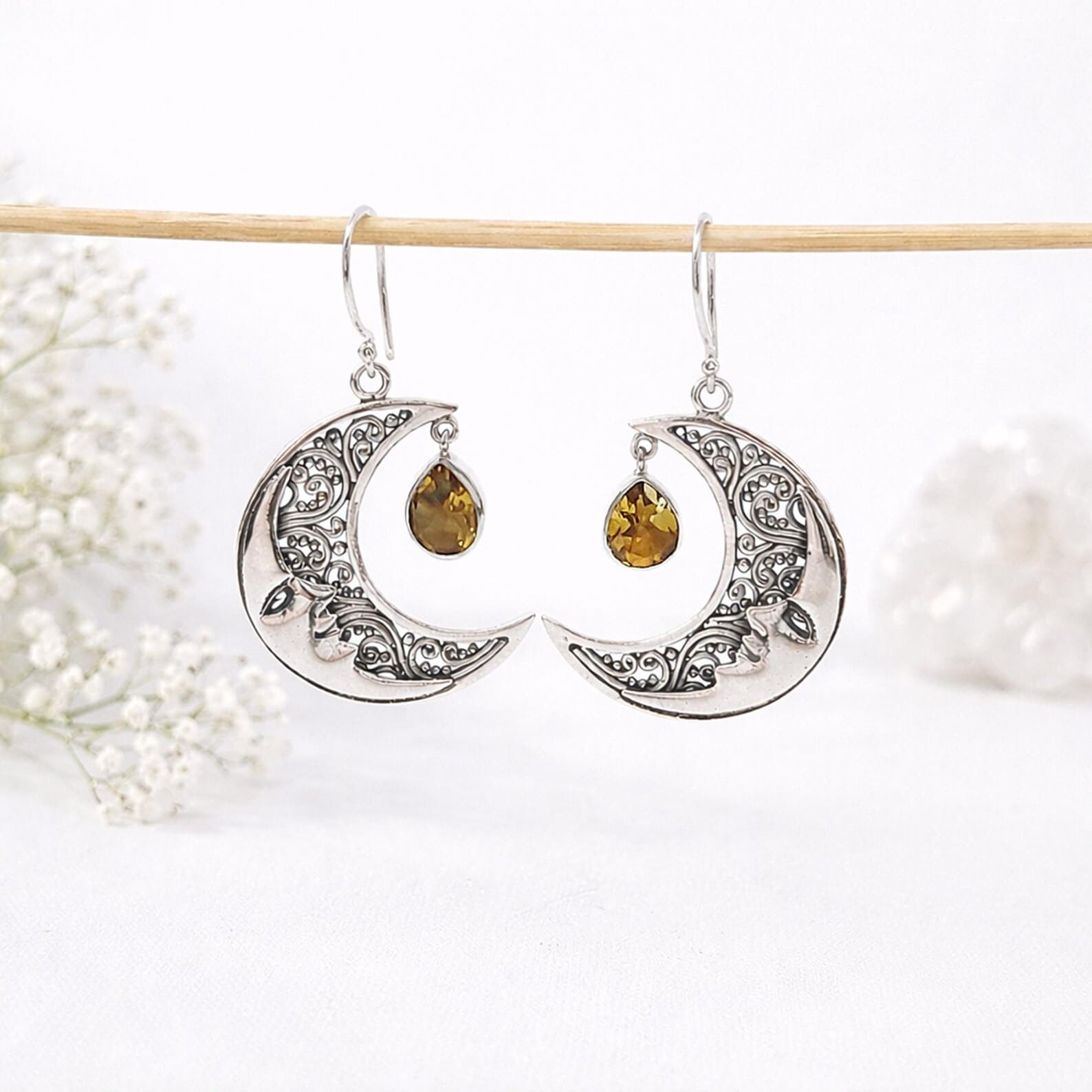 Moon Face Earrings Front View Artisan crafted moon face earrings in bohemian style