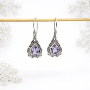 Close-up of elegant gemstone drop earrings in sterling silver