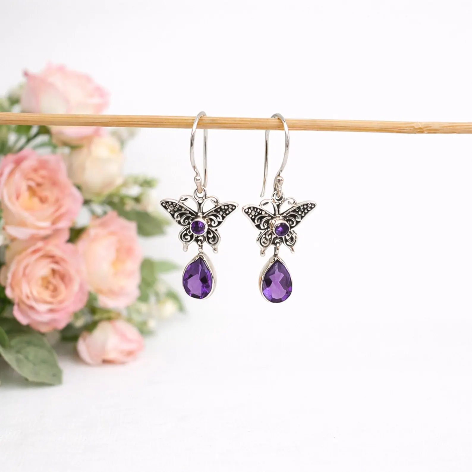 Boho Butterfly Earrings Side View Close-up of delicate butterfly earrings in sterling silver