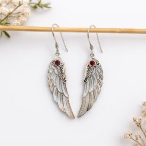 Handmade sterling silver wing earrings inspired by protection and freedom