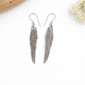 Handmade sterling silver feather earrings inspired by freedom and lightness