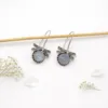 Elegant sterling silver insect earrings with symbolic meaning