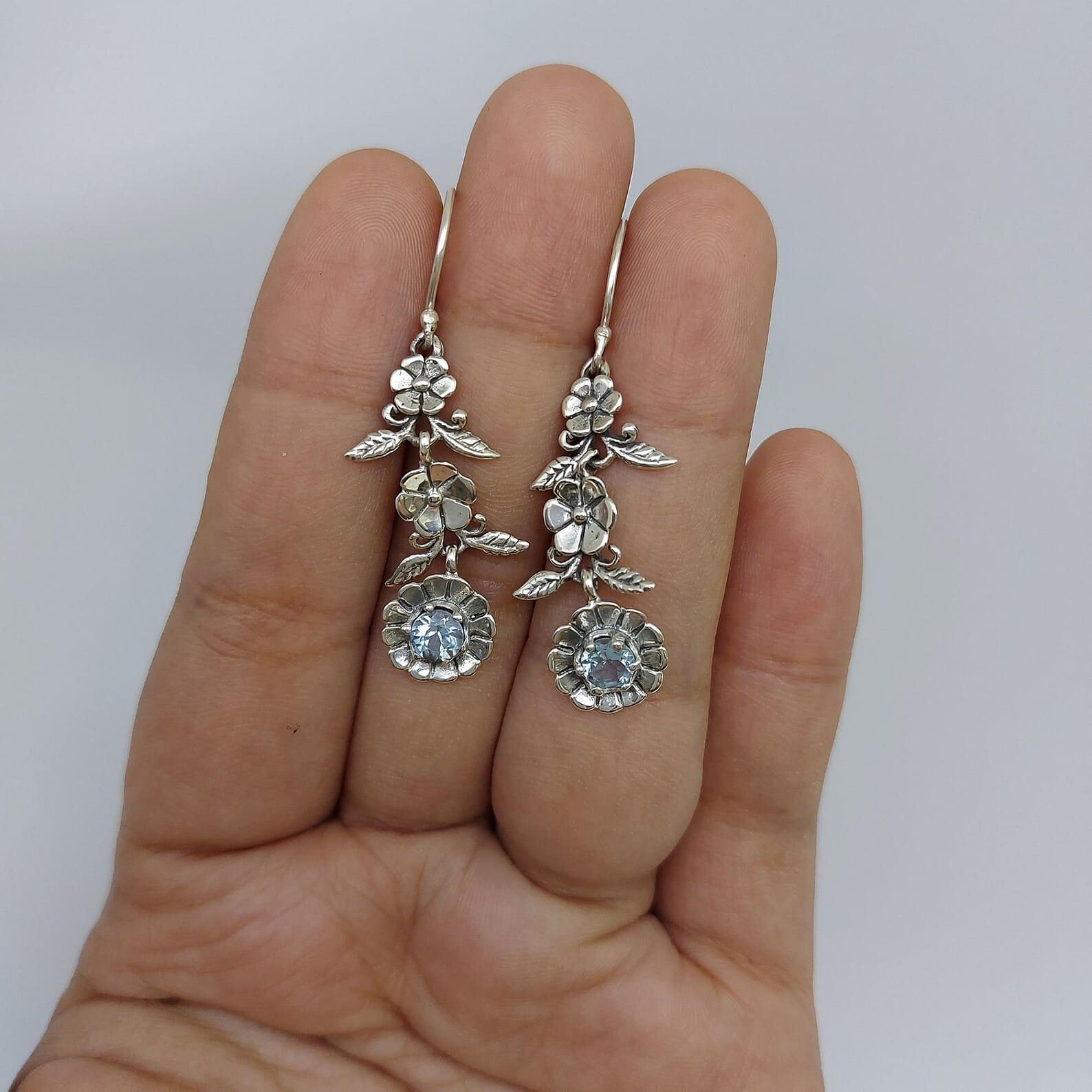 Sterling Silver Floral Earrings Close-up Close-up of floral silver earrings with detailed petals