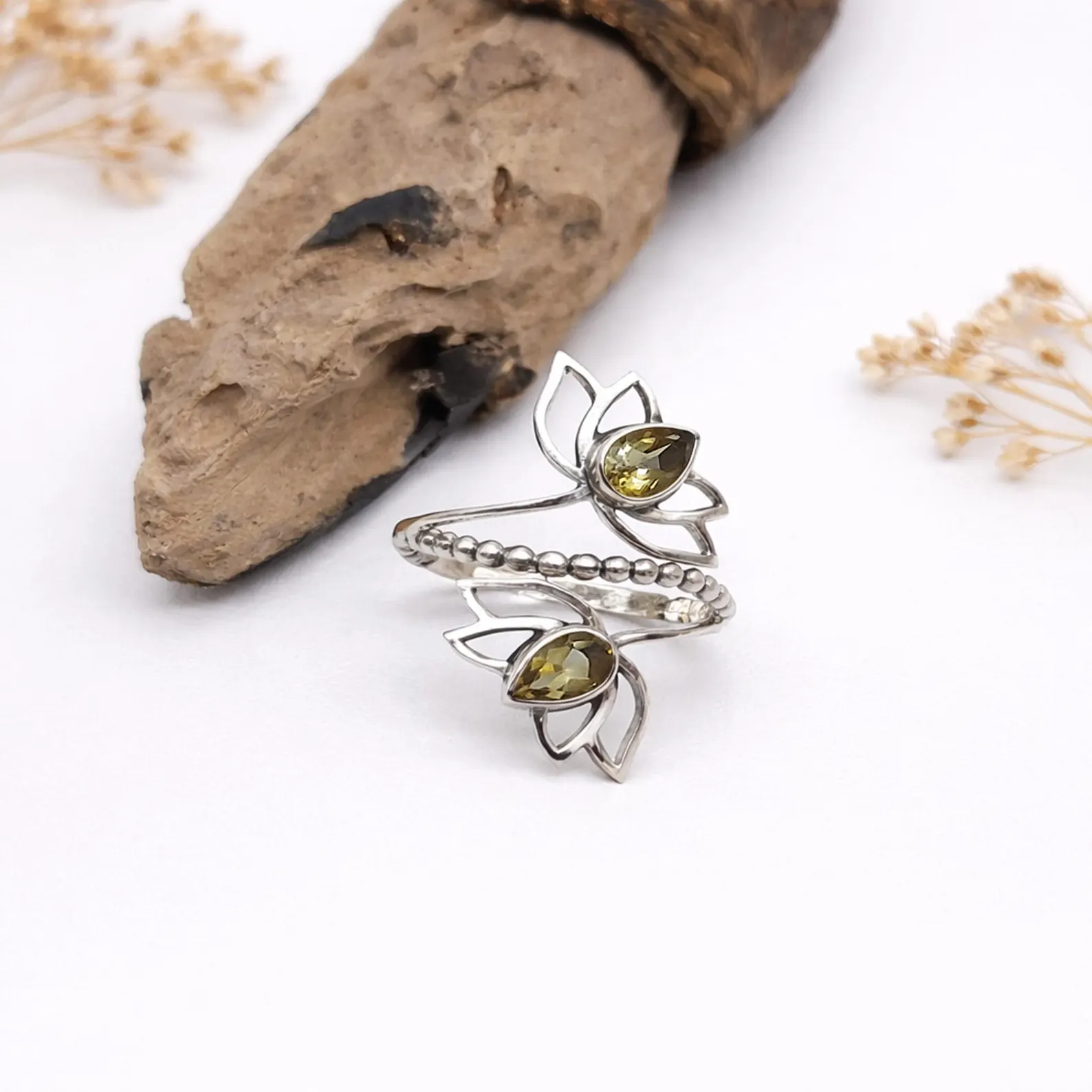 Handmade Bali Lotus Ring On Hand Lifestyle Shot Handmade Bali silver lotus ring premium artisan craftsmanship detail