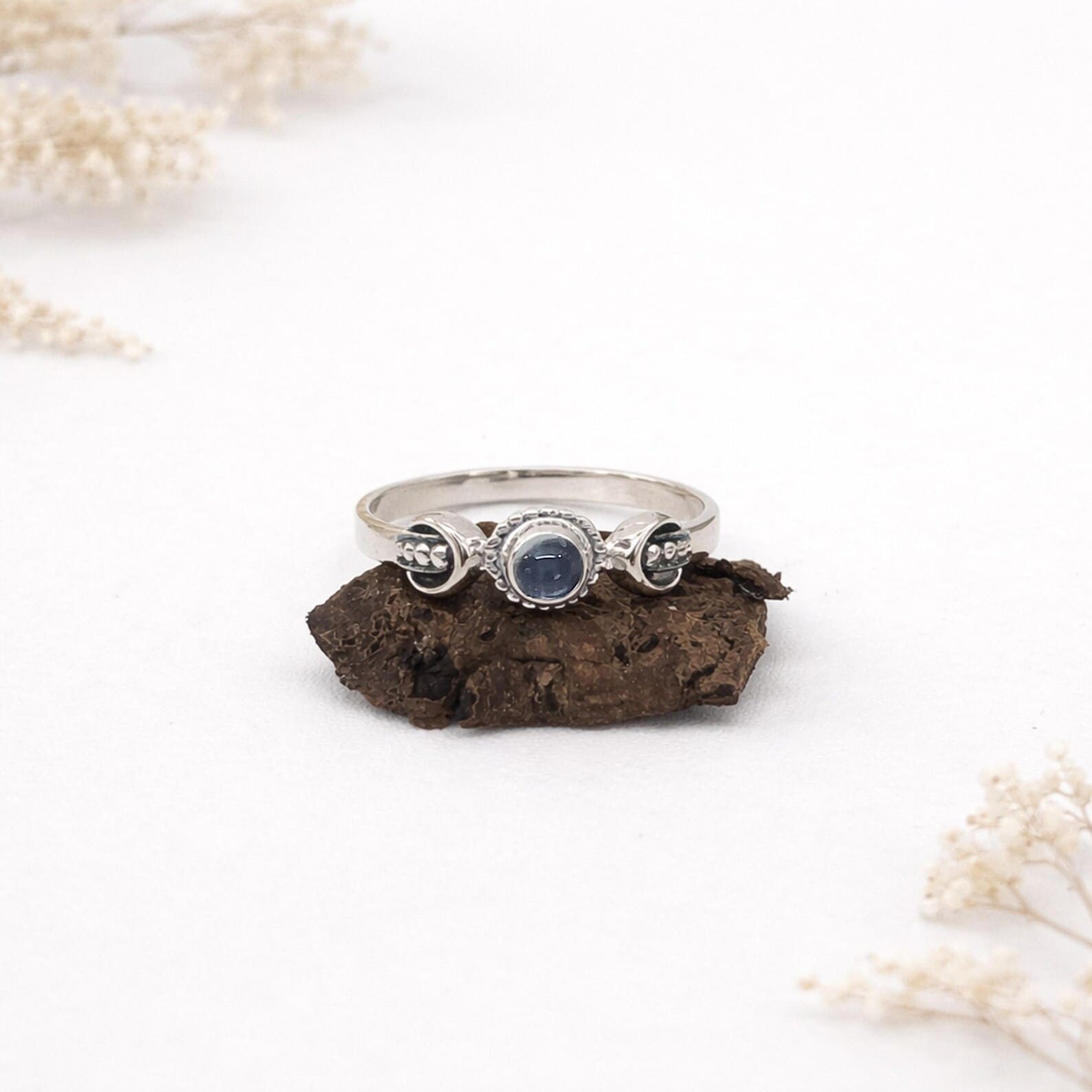 Close Up Moon Inspired Silver Ring Detail Macro Flat lay of minimalist sterling silver celestial ring design