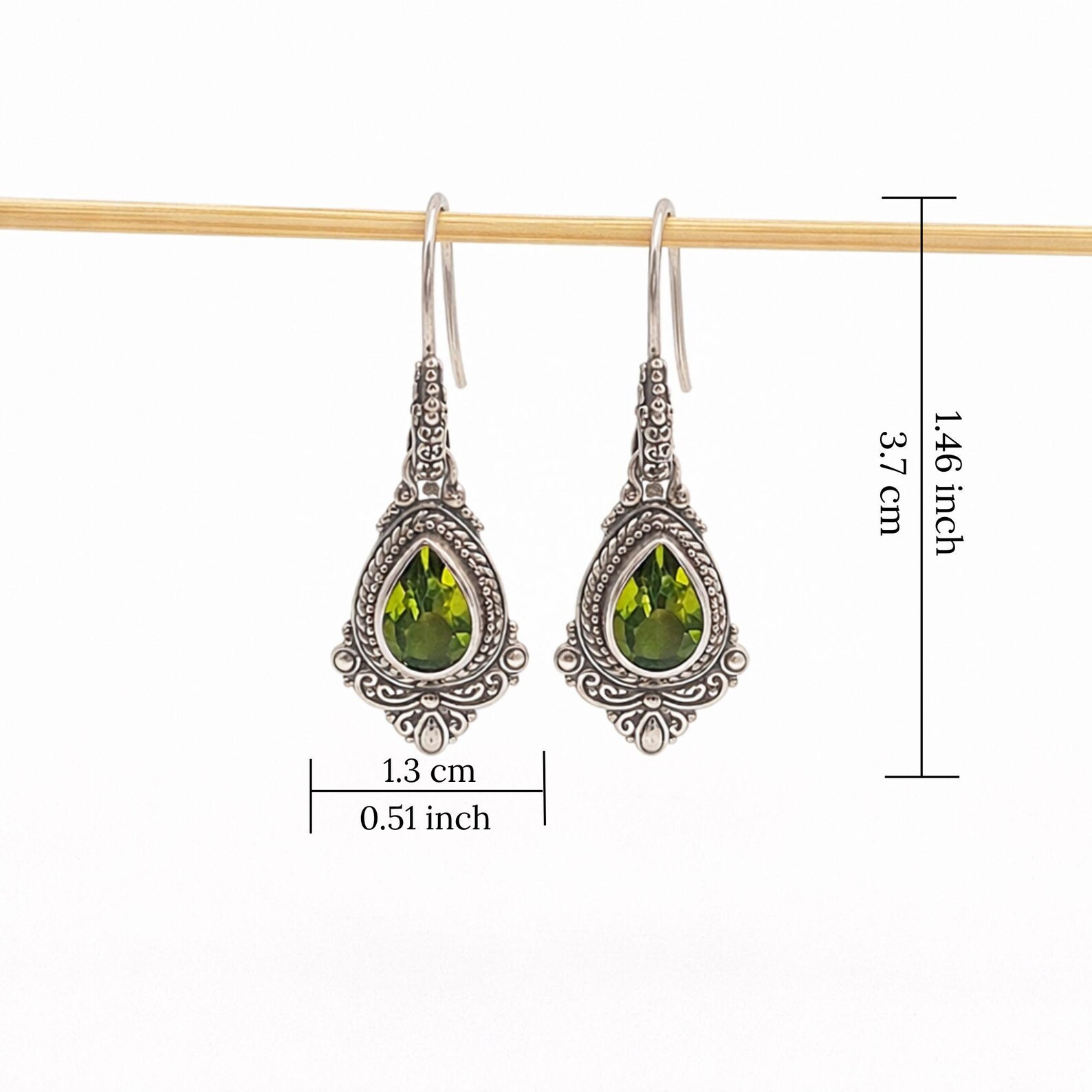 Handmade Silver Earrings on Model Handmade sterling silver teardrop gemstone dangle earrings vintage style