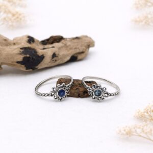 Flat lay of vintage sterling silver engraved ring minimalist styling