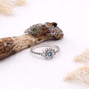Bohemian floral ring styled in natural light aesthetic photography