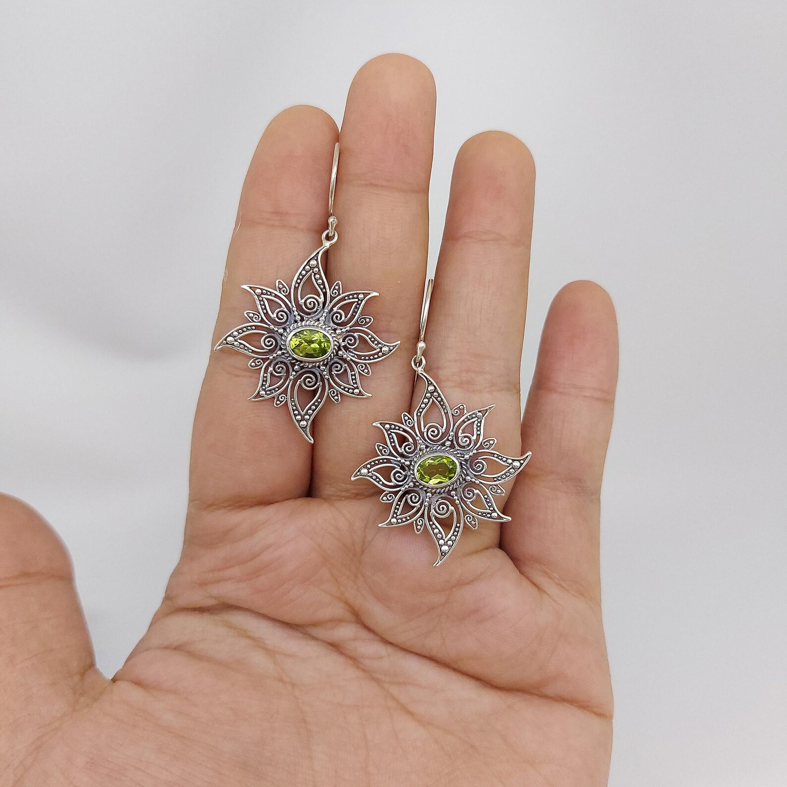 Radiant Sun Earrings on Model Close-up of boho sun earrings with detailed celestial design
