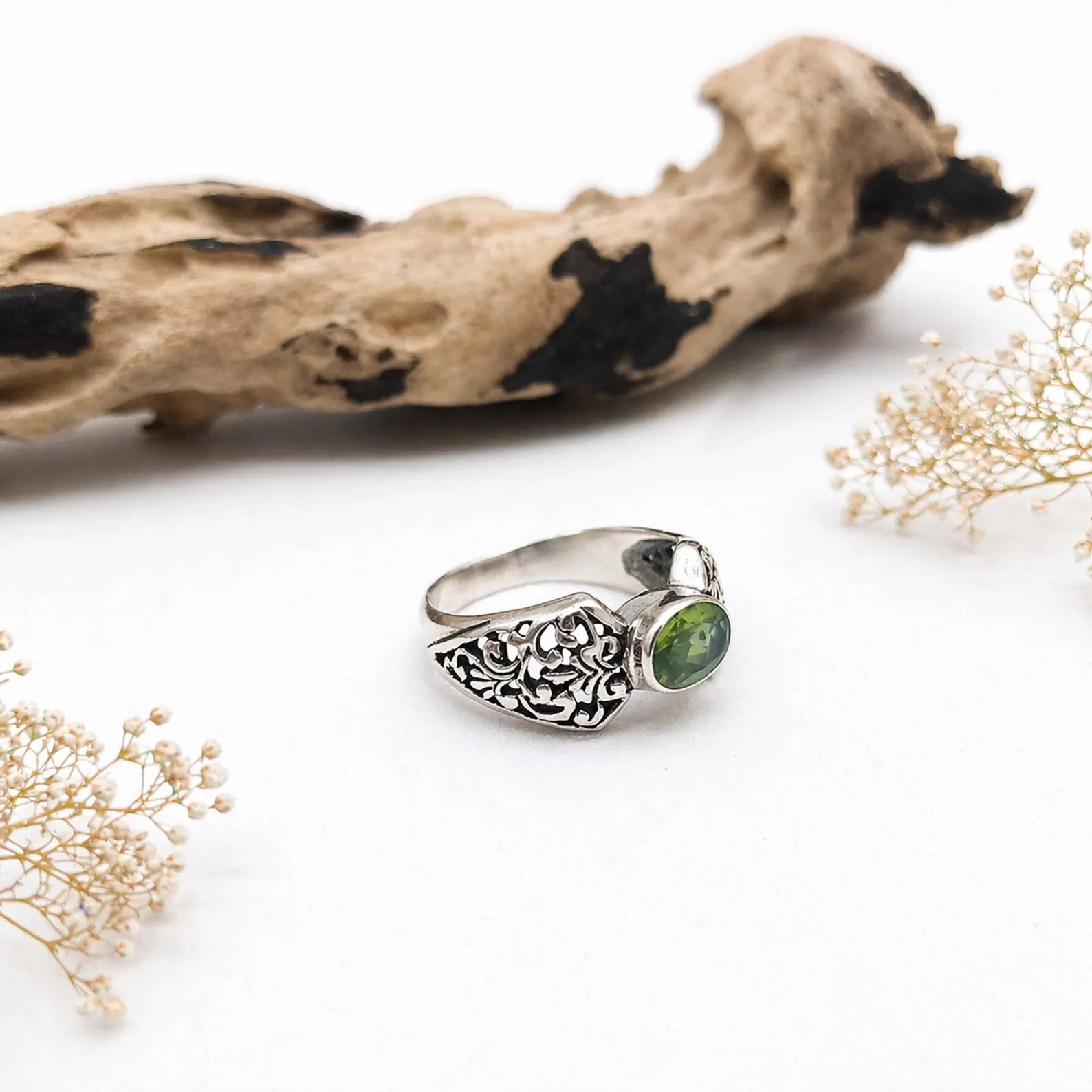 Floral Pattern Sterling Silver Ring Flat Lay Boho sterling silver ring minimal design worn on finger lifestyle shot