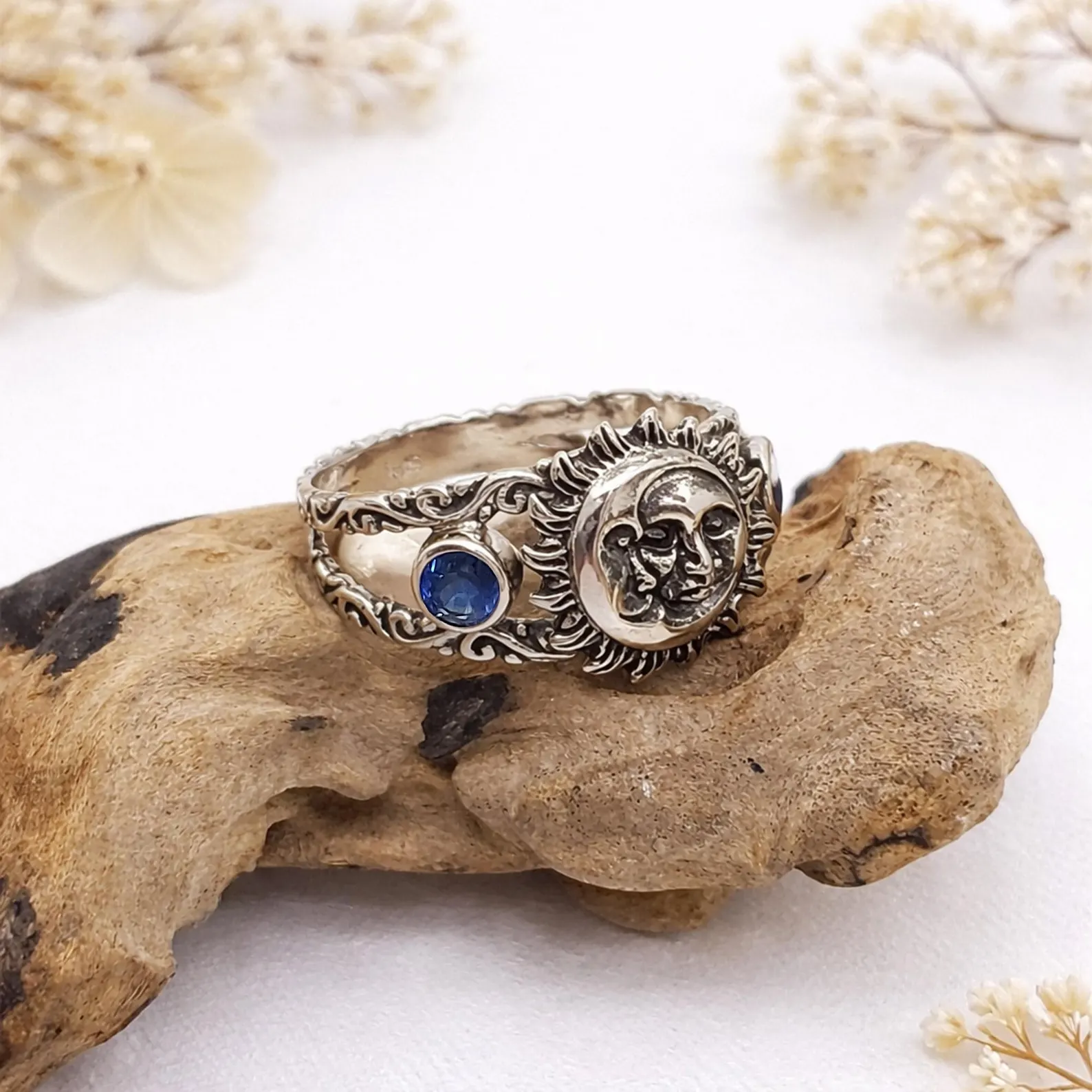 Handmade Bali Sun Moon Ring On Hand Lifestyle Shot Detailed sun and moon motif silver ring macro jewelry shot