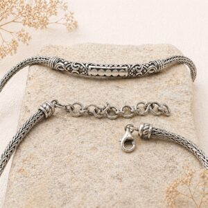 Flat lay of 925 sterling silver braided chain bracelet