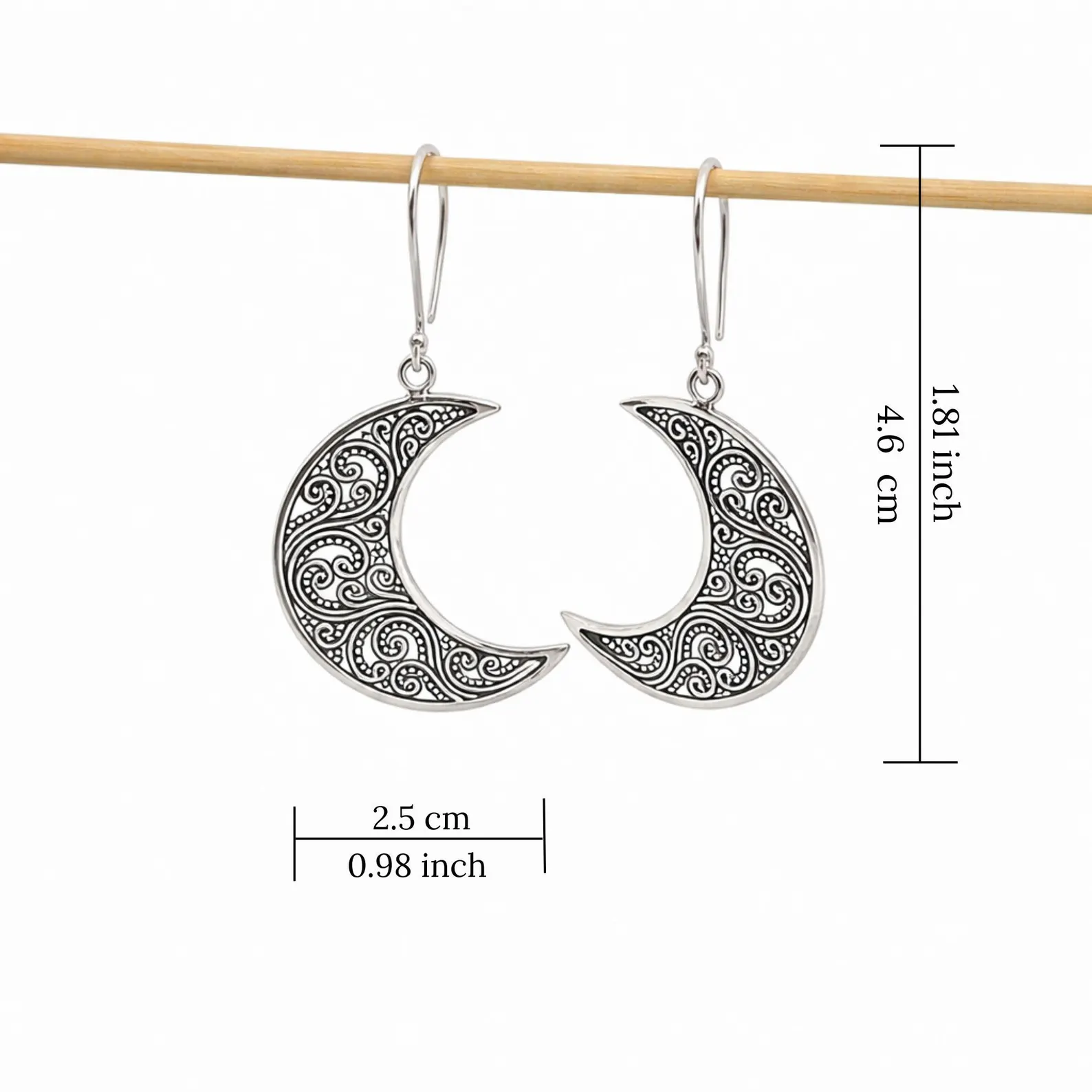 Handmade Lunar Earrings Side View Close-up of boho lunar silver earrings with delicate filigree design