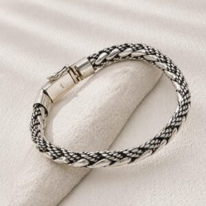Thick handmade silver bracelet with artisan finish