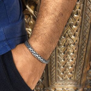 Close-up of wide woven silver bracelet detail