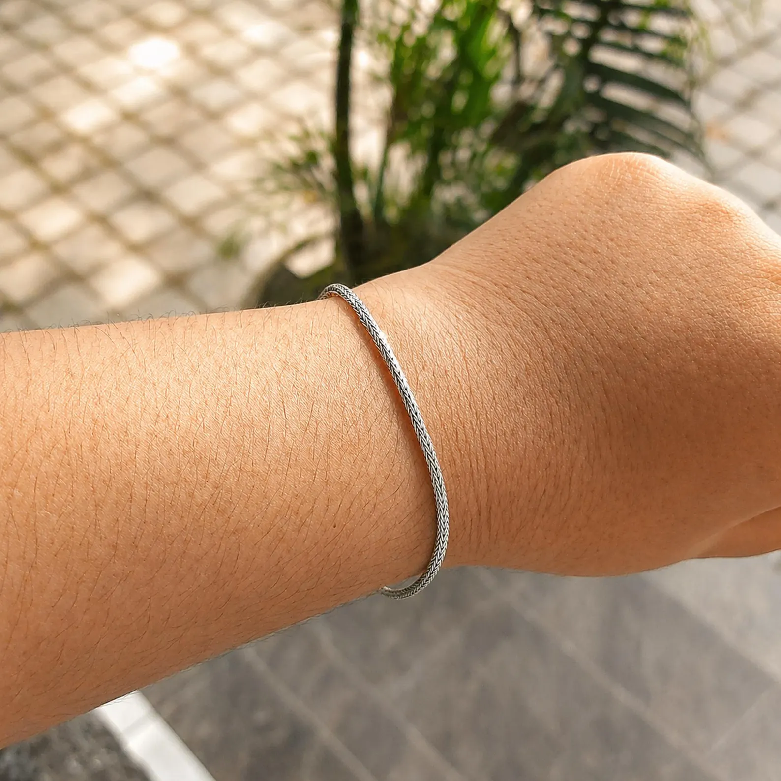 2mm Sterling Silver Woven Bracelet Front View Flat lay of 925 sterling silver minimalist chain bracelet