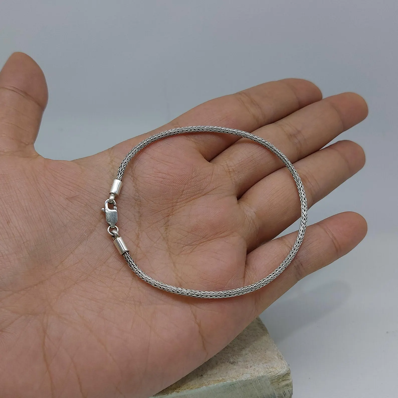 Thin Silver Bracelet on Wrist