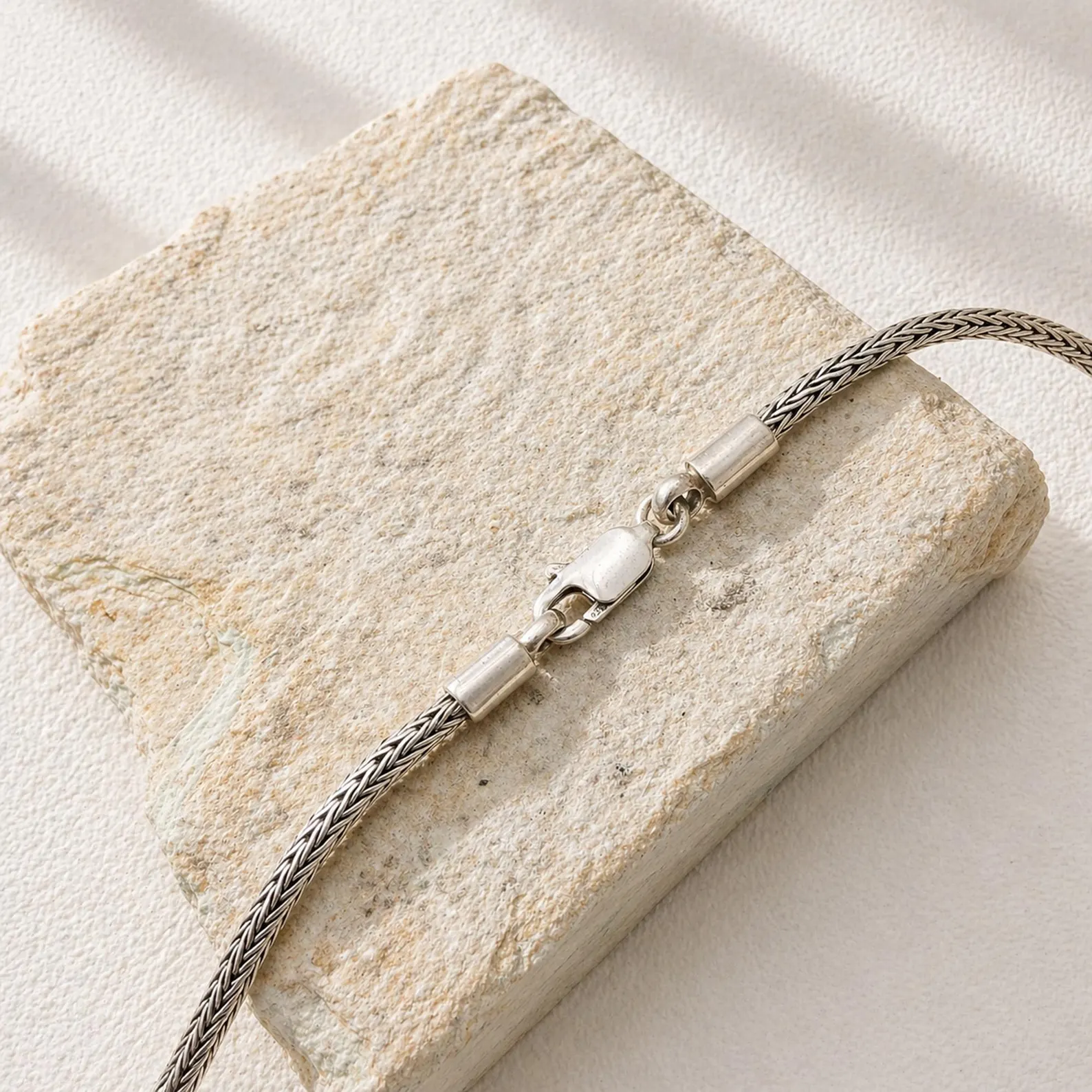 Minimalist 2mm Chain Bracelet Studio Shot Handmade 2mm sterling silver woven chain bracelet with delicate texture