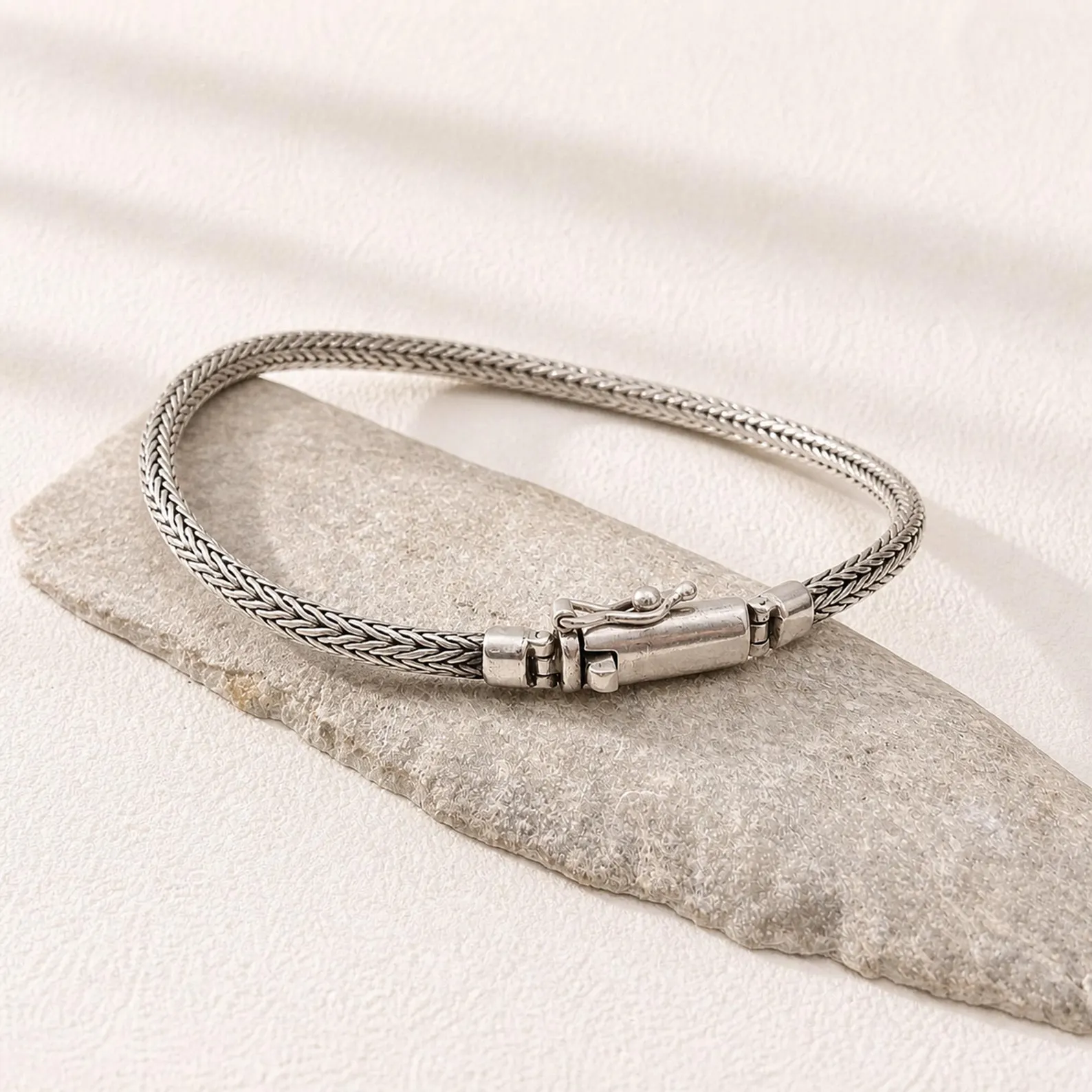 Tulang Style Silver Bracelet on Wrist Sterling silver bracelet clasp detail close-up shot