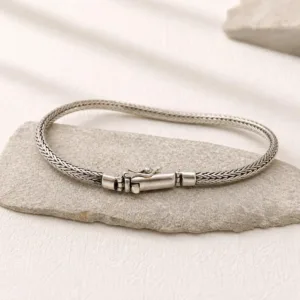 Tulang style silver bracelet worn on wrist
