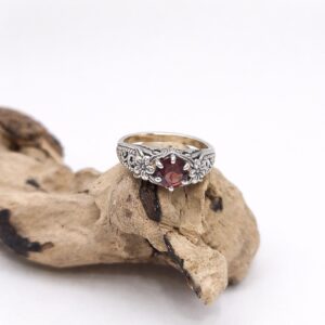 Flat lay of handmade sterling silver flower ring premium styling