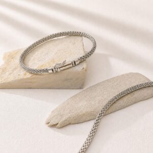 Minimalist sterling silver bracelet worn on wrist