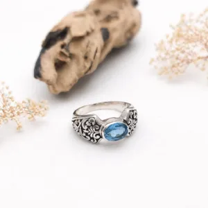 Close-up macro detail of floral engraved sterling silver band ring