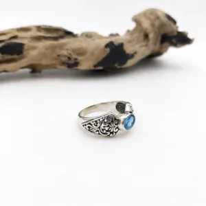 Flat lay of minimalist floral sterling silver ring premium styling