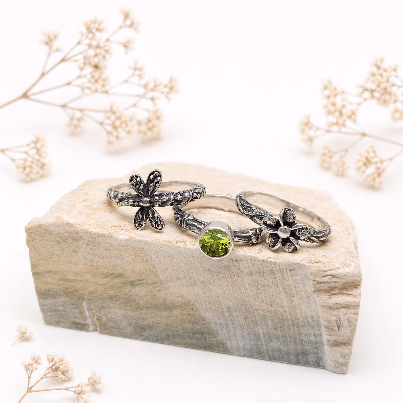 Boho Stackable Rings Outdoor Lifestyle Natural Light1 Frangipani flower silver ring close-up artisan craftsmanship detail