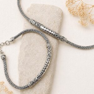 Close-up of detailed braided silver bracelet texture