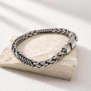 Minimalist sterling silver chain bracelet worn on wrist