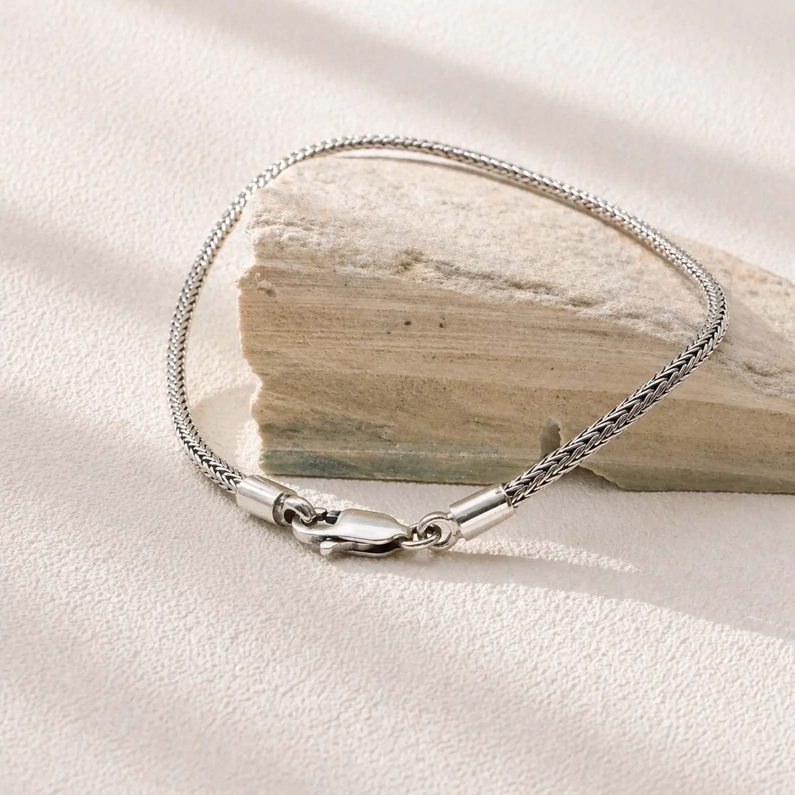 Fine Woven Bracelet Side View Close-up of fine woven silver bracelet detail