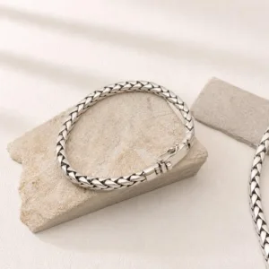 Close-up of detailed wheat chain bracelet in sterling silver
