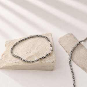 Flat lay of 925 sterling silver thin chain bracelet
