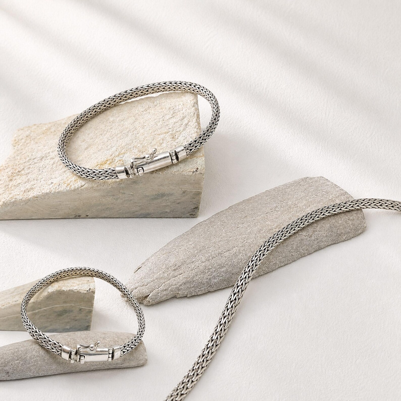 Boho Layered Silver Bracelet Styling Flat lay of 925 sterling silver herringbone bracelet for women