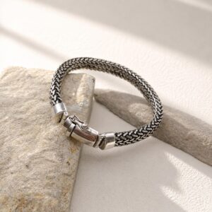 Close-up of detailed silver mesh bracelet texture