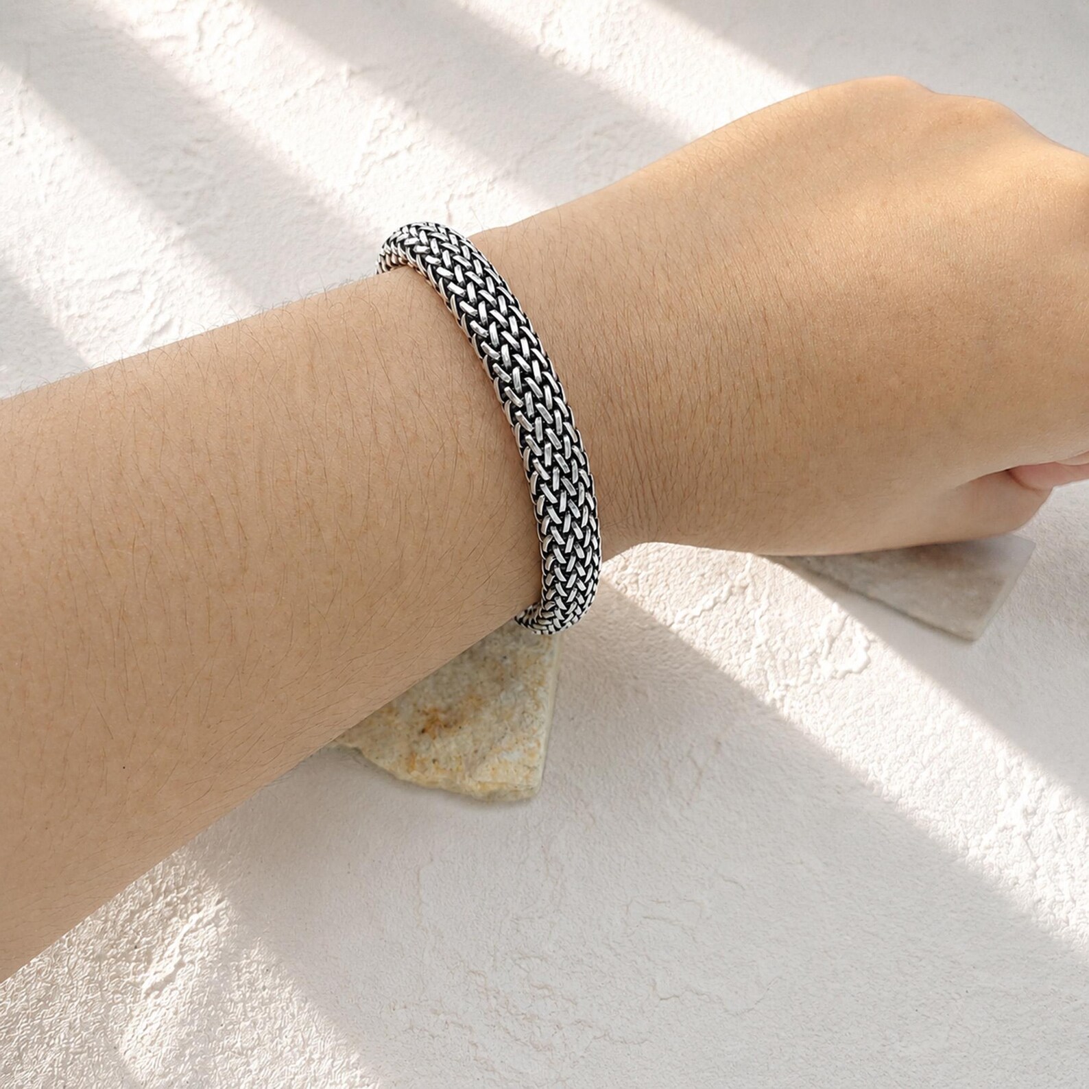 Elegant Woven Bracelet Side View Handmade sterling silver mesh bracelet with flexible woven design