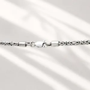 Elegant minimalist silver chain worn on neck lifestyle jewelry shot